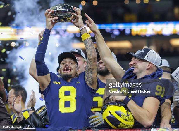 Ronnie Bell and Taylor Upshaw of the Michigan Wolverines holds the Big Ten trophy following the game against the Purdue Boilermakers in the Big Ten...