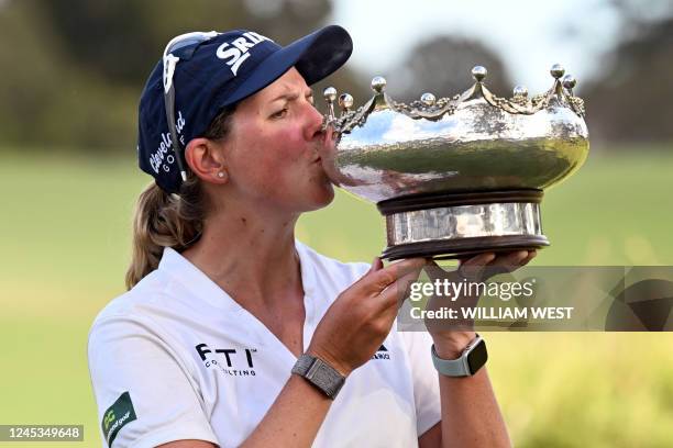 South Africa's Ashleigh Buhai kisses the trophy after winning the women's Australian Open golf tournament at the Victoria course in Melbourne on...