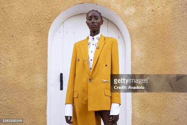 Model poses for a photo in the backstage of podium during the 20th Dakar Fashion Week in Goree Island, Dakar, Senegal on December 04, 2022.