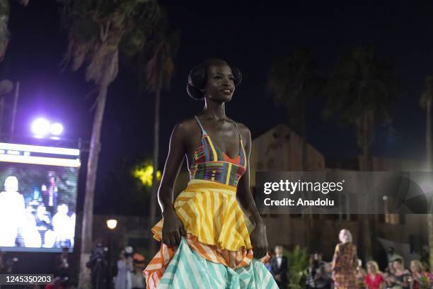 Model walks the runway during the 20th Dakar Fashion Week in Goree Island, Dakar, Senegal on December 04, 2022.