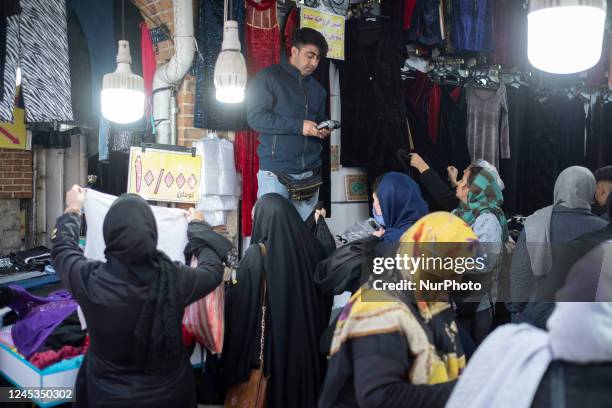 Iranian women shopping at a dress shop near Tehran Grand Bazaar , December 3, 2022.