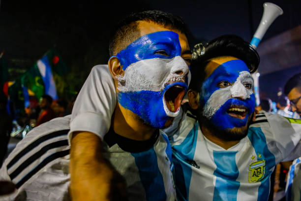 Football fans are reacting as they watch the Qatar 2022 World Cup round of 16 football match between Argentina and Australia on a big screen in the...