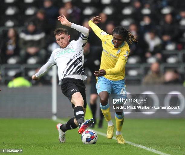 Derby County's Max Bird in action with Sheffield Wednesday's Alex Mighten during the Sky Bet League One between Port Vale and Charlton Athletic at...