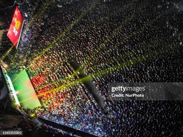 This aerial photograph shows football fans watching the Qatar 2022 World Cup round of 16 football matches between Argentina and Australia on a big...