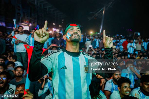 Football fans are reacting as they watch the Qatar 2022 World Cup round of 16 football match between Argentina and Australia on a big screen in the...