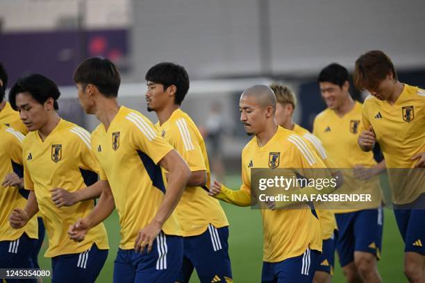 Japan's forward Daizen Maeda takes part in a training session with teammates at the Al Sadd SC training grounds in Doha on December 4 on the eve of...