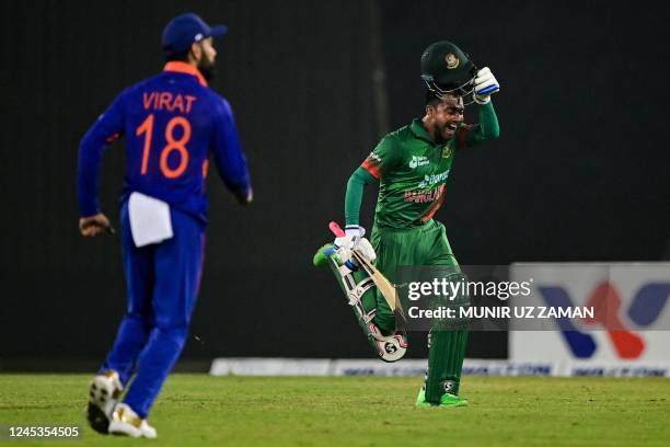 Bangladesh's Mahidy Hassan Miraz celebrates after his teams's victory in the first one-day international cricket match between Bangladesh and India...