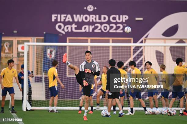Japan's goalkeeper Eiji Kawashima takes part in a training session at the Al Sadd SC training grounds in Doha on December 4 on the eve of the Qatar...