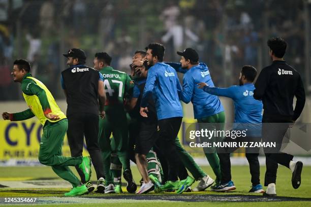 Bangladesh's team members celebrate their win in the first one-day international cricket match between Bangladesh and India at the Sher-e-Bangla...