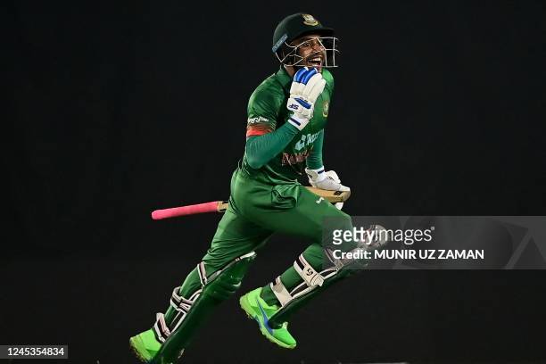 Bangladesh's Mahidy Hassan Miraz celebrates after his teams's victory in the first one-day international cricket match between Bangladesh and India...