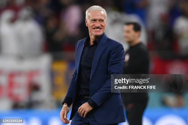 France's coach Didier Deschamps celebrates after his team won the Qatar 2022 World Cup round of 16 football match between France and Poland at the...