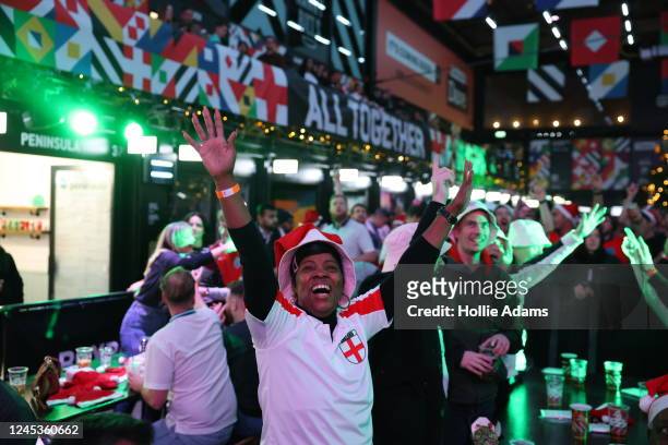 England fans cheer prior to watching England in their Round of 16 FIFA World Cup match against Senegal at BOXPARK Croydon on December 4, 2022 in...