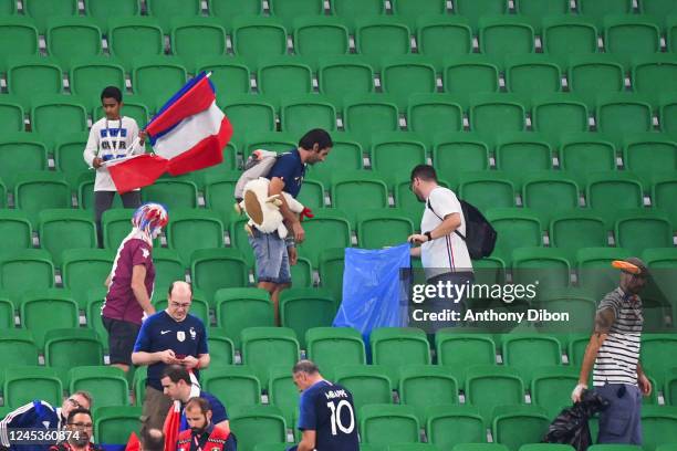 Fans of France cleans the stands during the FIFA World Cup 2022, Round of 16 match between France and Poland at Al Thumama Stadium on December 4,...