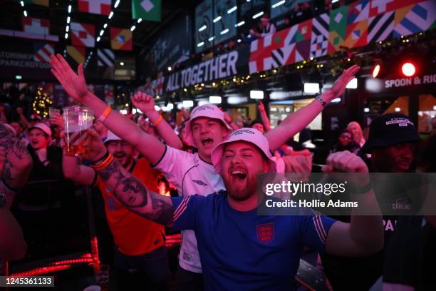 England fans cheer prior to watching England in their Round of 16 FIFA World Cup match against Senegal at BOXPARK Croydon on December 4, 2022 in...