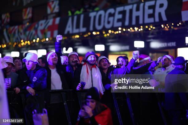 England fans cheer prior to watching England in their Round of 16 FIFA World Cup match against Senegal at BOXPARK Croydon on December 4, 2022 in...