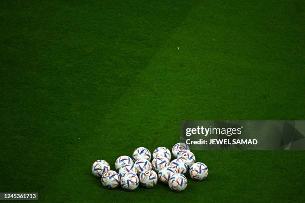 The official ball is pictured on the pitch prior to the Qatar 2022 World Cup round of 16 football match between England and Senegal at the Al-Bayt...