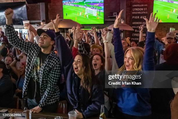 Hermosa Beach, CA Harrison Kidd, left, Allie Paul and Jen Fisch celebrate as U.S. Men's national team scores their first and only goal against...