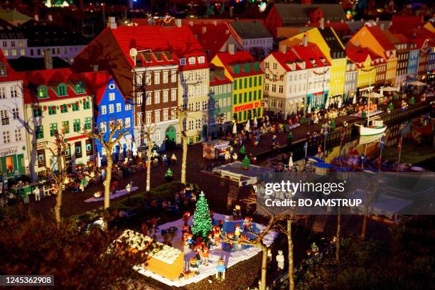 Photo taken on December 4, 2022 shows small-scale houses made out of Lego bricks at the Legoland amusement park in Billund, Denmark. - For the first...