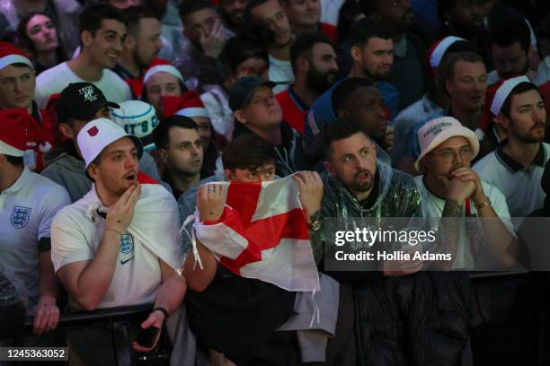 England fans watch England in their Round of 16 FIFA World Cup match against Senegal at BOXPARK Croydon on December 4, 2022 in Croydon, England.