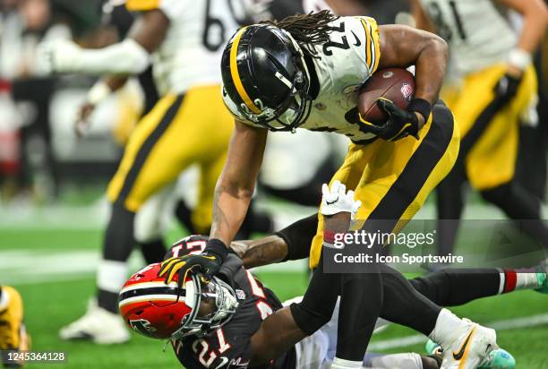 Pittsburgh running back Najee Harris shoves Atlanta safety Richie Grant to the ground during the NFL game between the Pittsburgh Steelers and the...