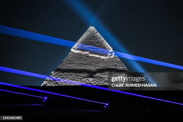 The Pyramid of Khafre is illuminated during the Christian Dior fashion show at the Giza Pyramids Necropolis on the outskirts of the twin city of...