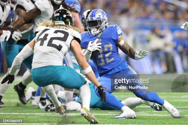 Detroit Lions running back D'Andre Swift runs the ball during the second half of an NFL football game between the Detroit Lions and the Jacksonville...