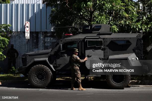 Soldier stands next to an armoured vehicle during an operation against gang members in Las Margaritas, a community historically controlled by the...