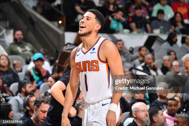 Devin Booker of the Phoenix Suns smiles during the game against the San Antonio Spurs on December 4, 2022 at the AT&T Center in San Antonio, Texas....
