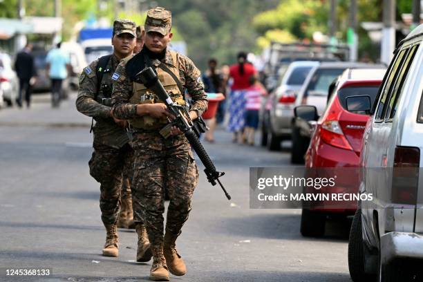 Soldiers patrol during an operation against gang members in La Campanera, a community historically controlled by the 18th street gang, in Soyapango,...