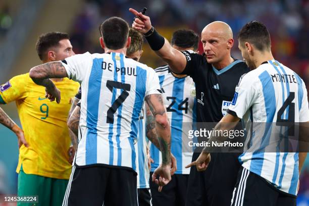 Szymon Marciniak referee, Rodrigo De Paul , Gonzalo Montiel during the World Cup match between Argentina v Australia , in Doha, Qatar, on December 3...