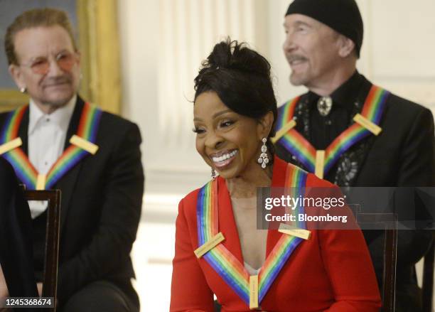 Musicians Gladys Knight, front, Bono, left, and the Edge attend the Kennedy Center honoree reception in the East Room of the White House in...