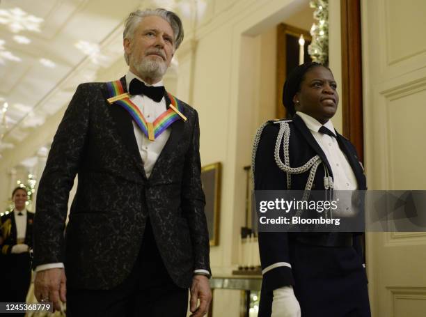 Band member Adam Clayton, left, attends the Kennedy Center honoree reception in the East Room of the White House in Washington, DC, US, on Sunday,...