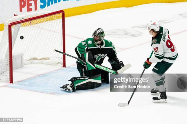 Kirill Kaprizov of the Minnesota Wild makes a shot over Scott Wedgewood of the Dallas Stars during shootouts at American Airlines Center on December...