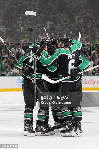 Jason Robertson and Colin Miller of the Dallas Stars celebrate a goal against the Minnesota Wild at the American Airlines Center on December 4, 2022...