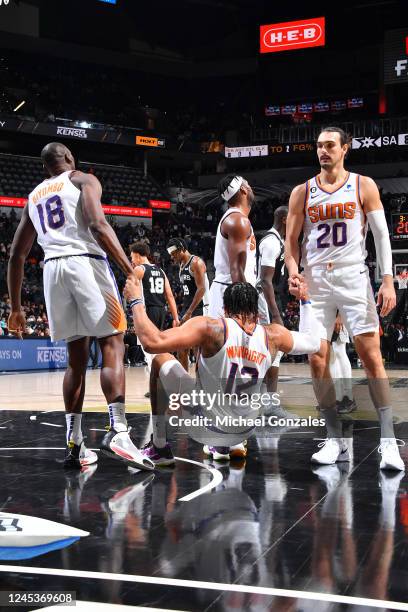 Ish Wainright of the Phoenix Suns is helped up during the game against the San Antonio Spurs on December 4, 2022 at the AT&T Center in San Antonio,...