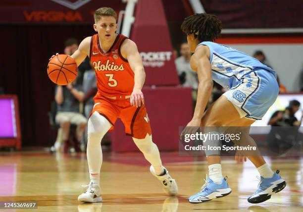 North Carolina Tar Heels guard Seth Trimble attempts to defend Virginia Tech Hokies guard Sean Pedulla during a men's college basketball game between...