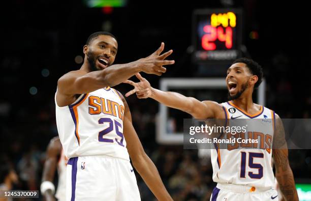 Mikal Bridges of the Phoenix Suns celebrates a three against the San Antonio Spurs with Cameron Payne in the first half of the game at AT&T Center on...