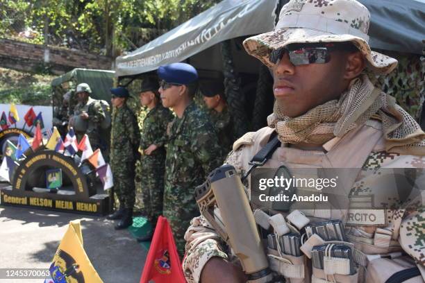 Soldiers are seen as the signatories of the former Revolutionary Armed Forces of Colombia and non-governmental organization members planted saplings...