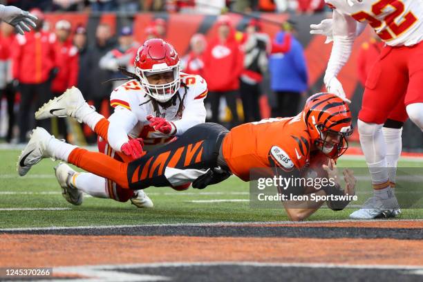 Cincinnati Bengals quarterback Joe Burrow dives into the end zone for a touchdown during the game against the Kansas City Chiefs and the Cincinnati...