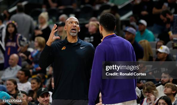 Monty Williams, head coach of the Phoenix Suns, talks with Devon ...