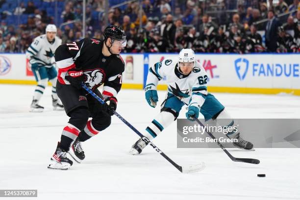 Peterka of the Buffalo Sabres skates with the puck against Kevin Labanc of the San Jose Sharks during an NHL game on December 4, 2022 at KeyBank...