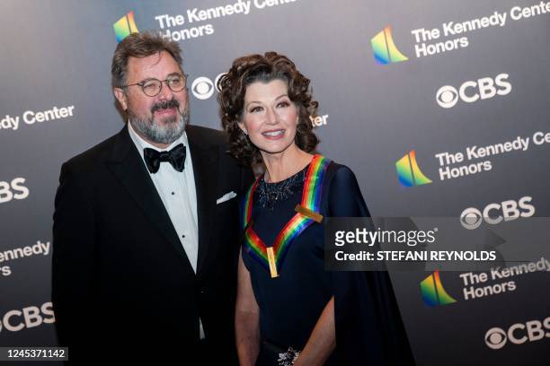 Singer-songwriter Amy Grant and her husband singer Vince Gill arrive for the 45th Kennedy Center Honors at the John F. Kennedy Center for the...