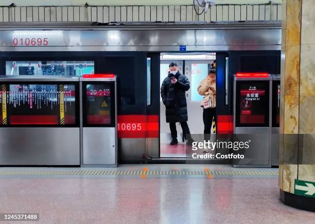 Light passenger flow is seen during the morning rush hour on Metro Line 5 in Beijing, China, December 5, 2022. On the same day, Beijing cancelled...