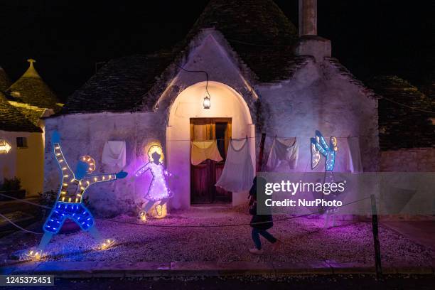 Characters of the nativity scene of light in the Aia Piccola district among the trulli of Alberobello, on the occasion of the Christmas holidays on...