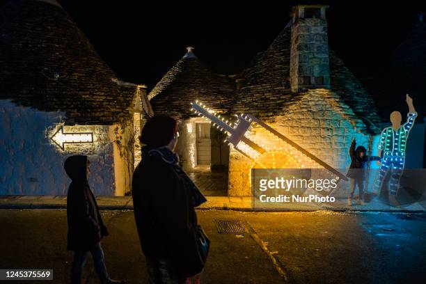 Characters of the nativity scene of light in the Aia Piccola district among the trulli of Alberobello, on the occasion of the Christmas holidays on...