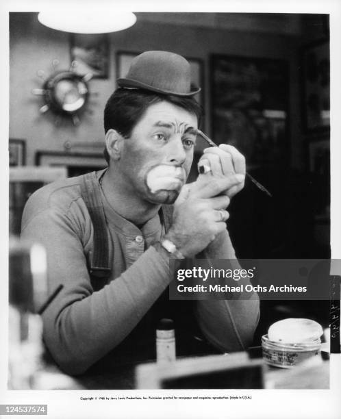 Jerry Lewis wearing clown make-up in a scene from the film 'The Family Jewels', 1965.