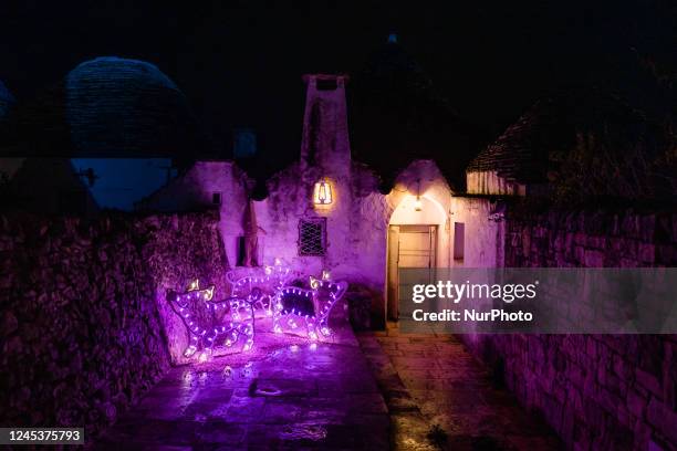 Characters of the nativity scene of light in the Aia Piccola district among the trulli of Alberobello, on the occasion of the Christmas holidays on...