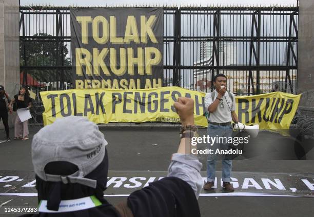 Number of activist for human rights hold a demonstration at the front parliament building against draft criminal code in Jakarta, Indonesia on...