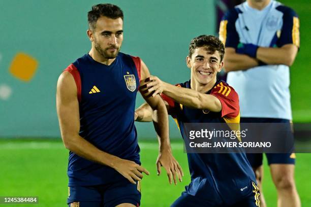 Spain's defender Eric Garcia and Spain's midfielder Gavi attend a training session at Qatar University in Doha, on December 5, 2022 on the eve of the...