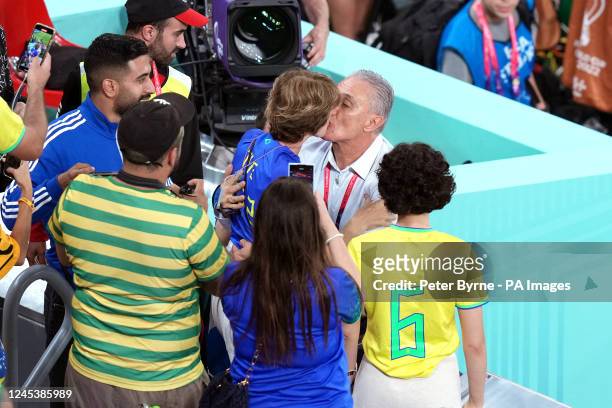 Brazil manager Tite kisses wife Rosmari Rizzi Bachi before the FIFA World Cup Round of Sixteen match at Stadium 974 in Doha, Qatar. Picture date:...